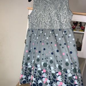 Grey cocktail dress with polka dots.